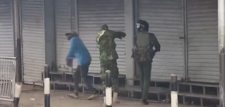 anti-riot police assaulting hawker